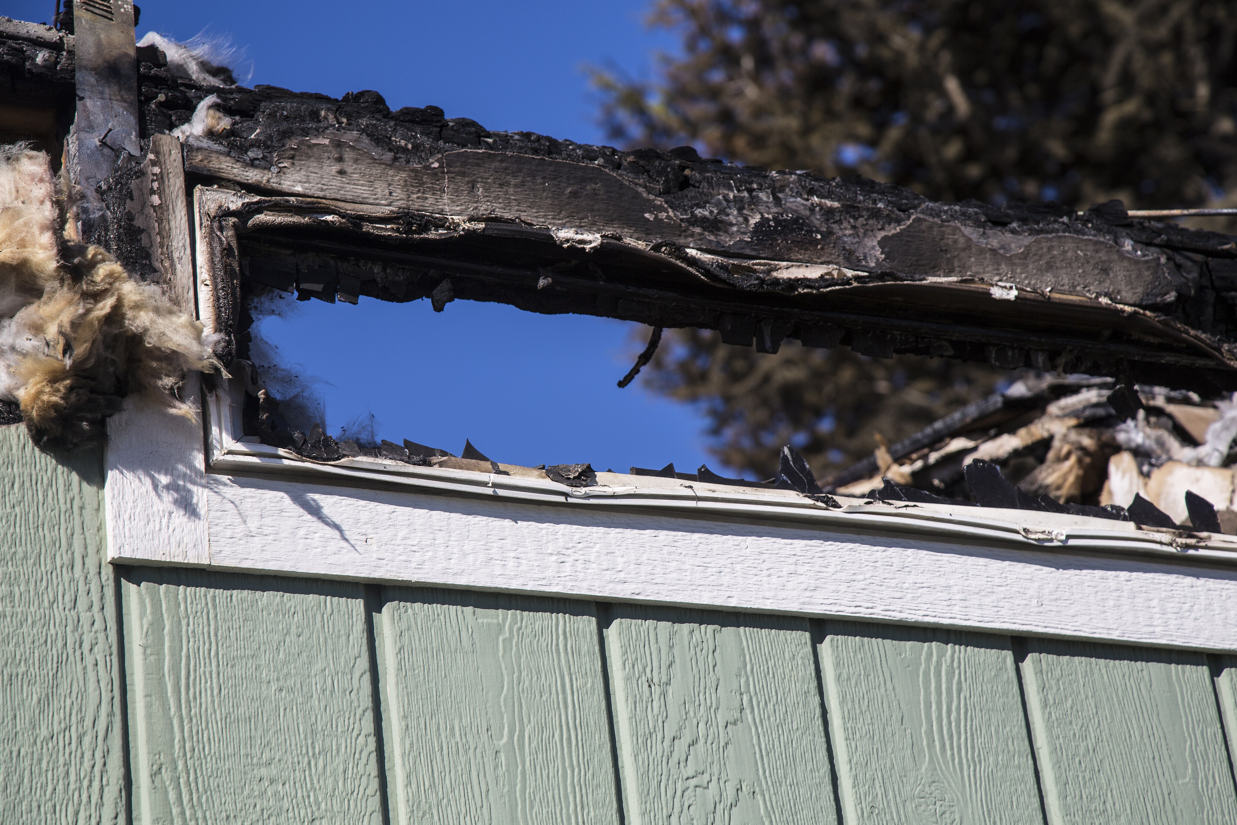 Woman Discovered in Burning Trailer Had Gunshot Wound